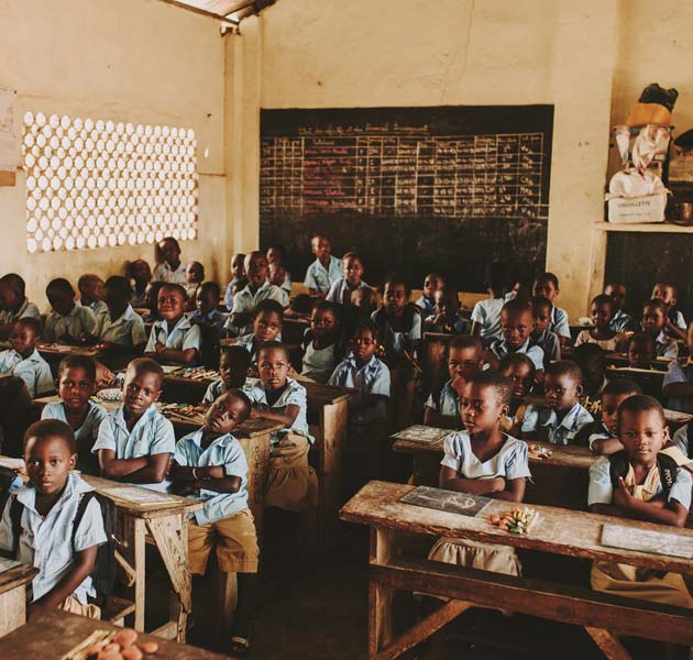 Children filling up a classroom in Togo