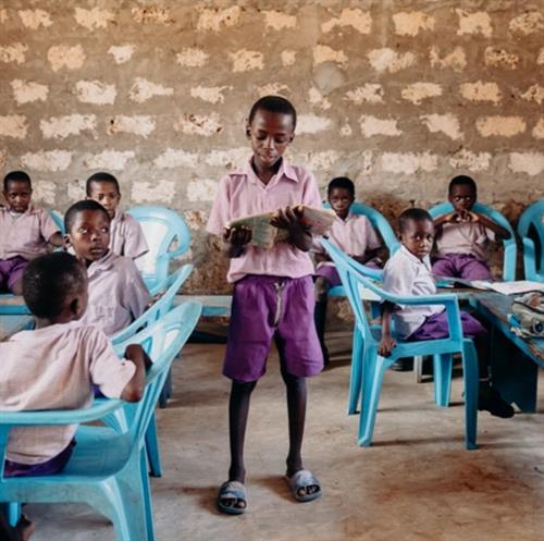 Child reads to class