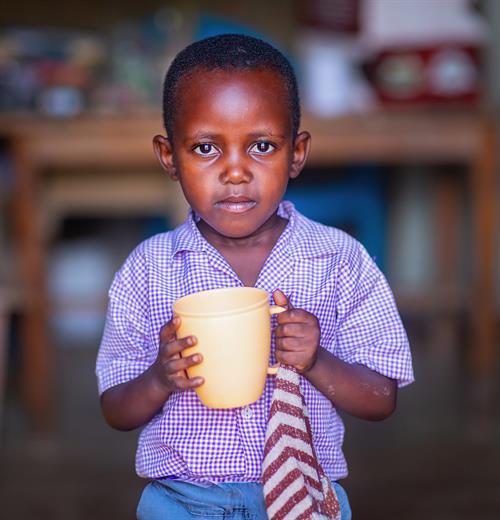 Child holding a mug