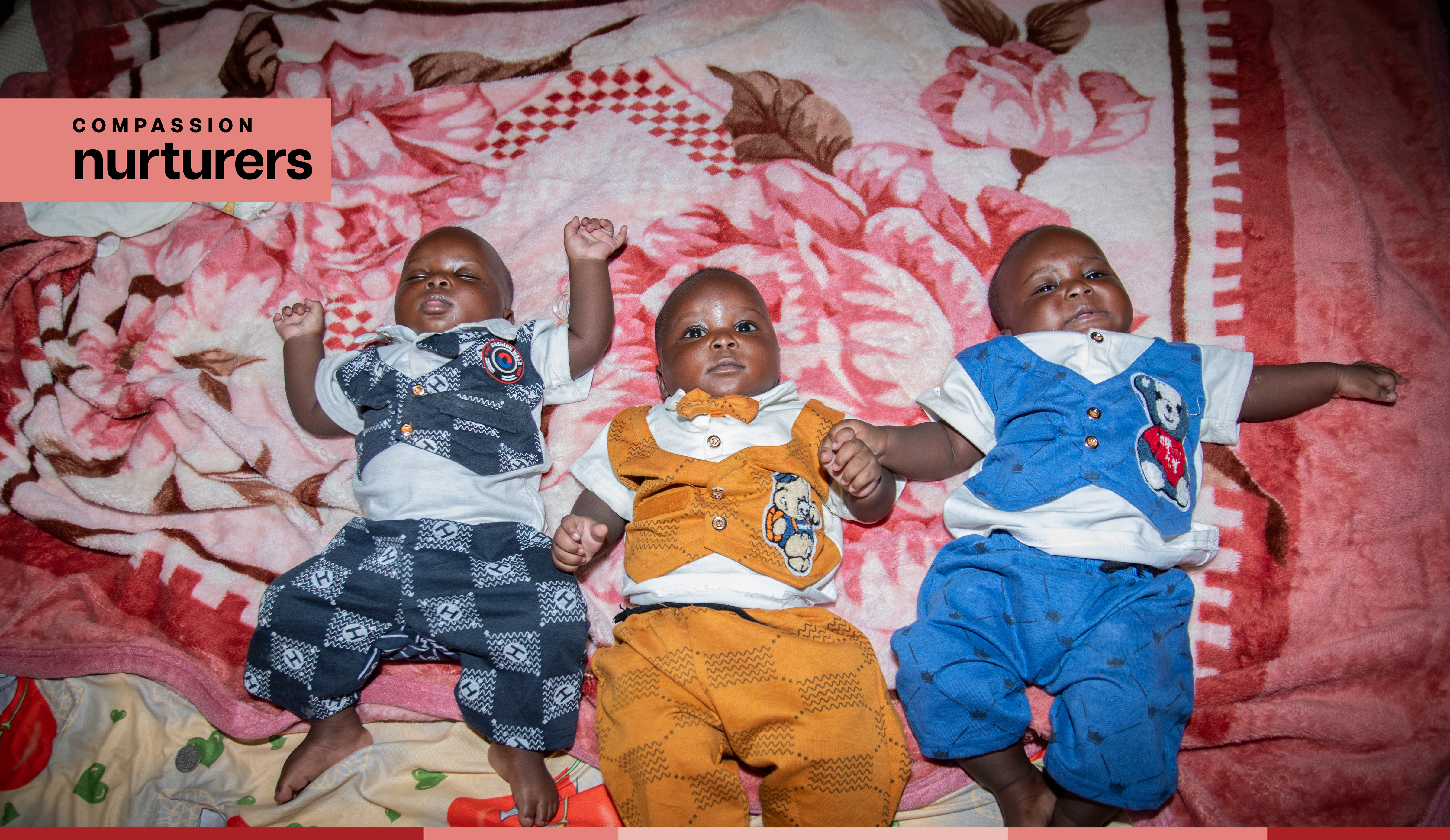 triplets in blue and yellow onesies