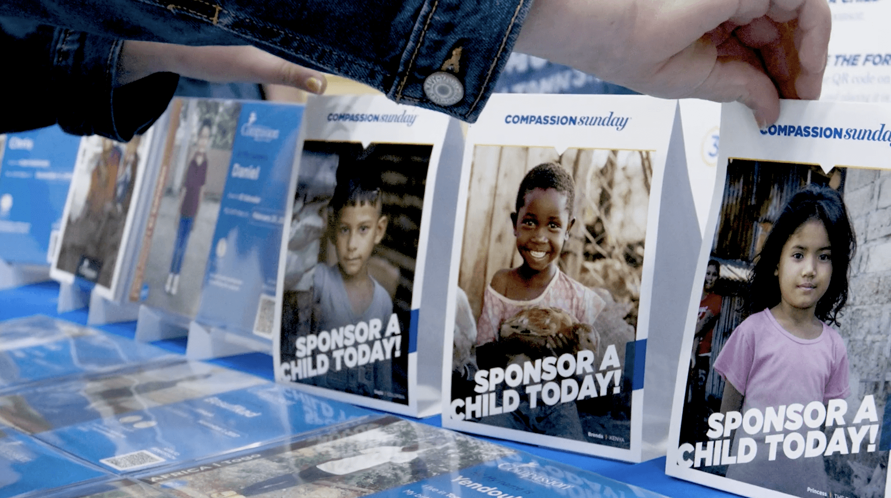 Displays for Compassion Sunday sit on a table.